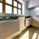 Kitchen with sleek cabinets using concealed European hinges.